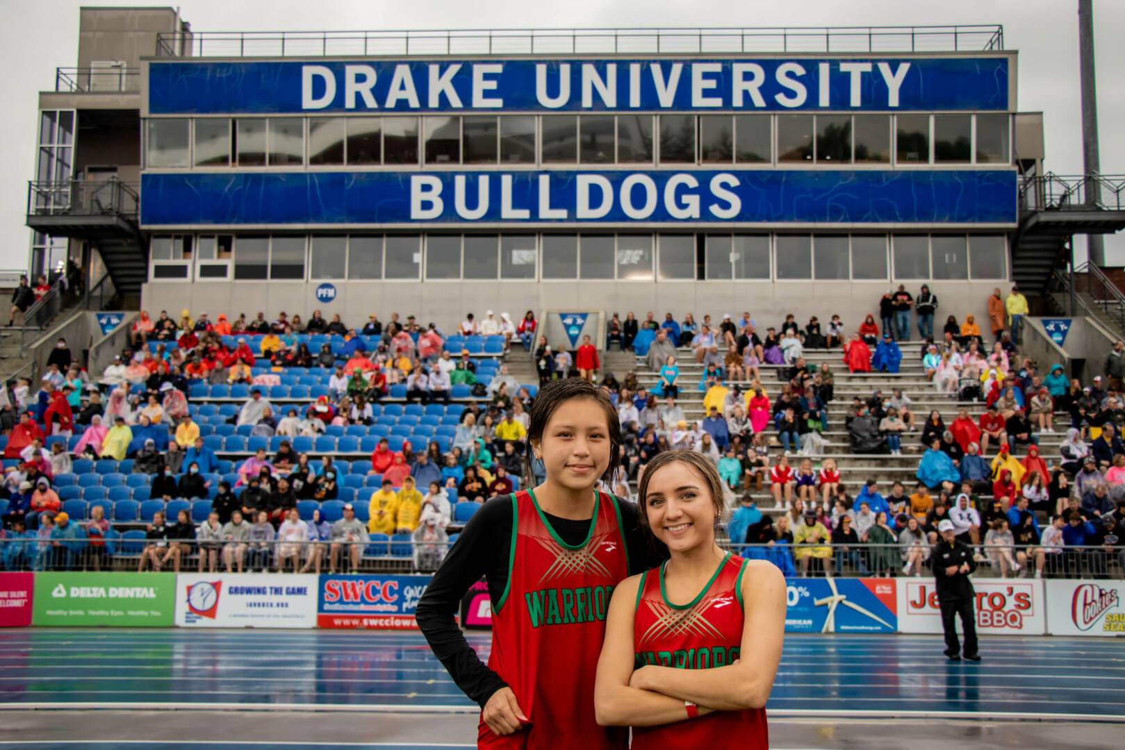 Two girls pose at the 2021 State Track Meet