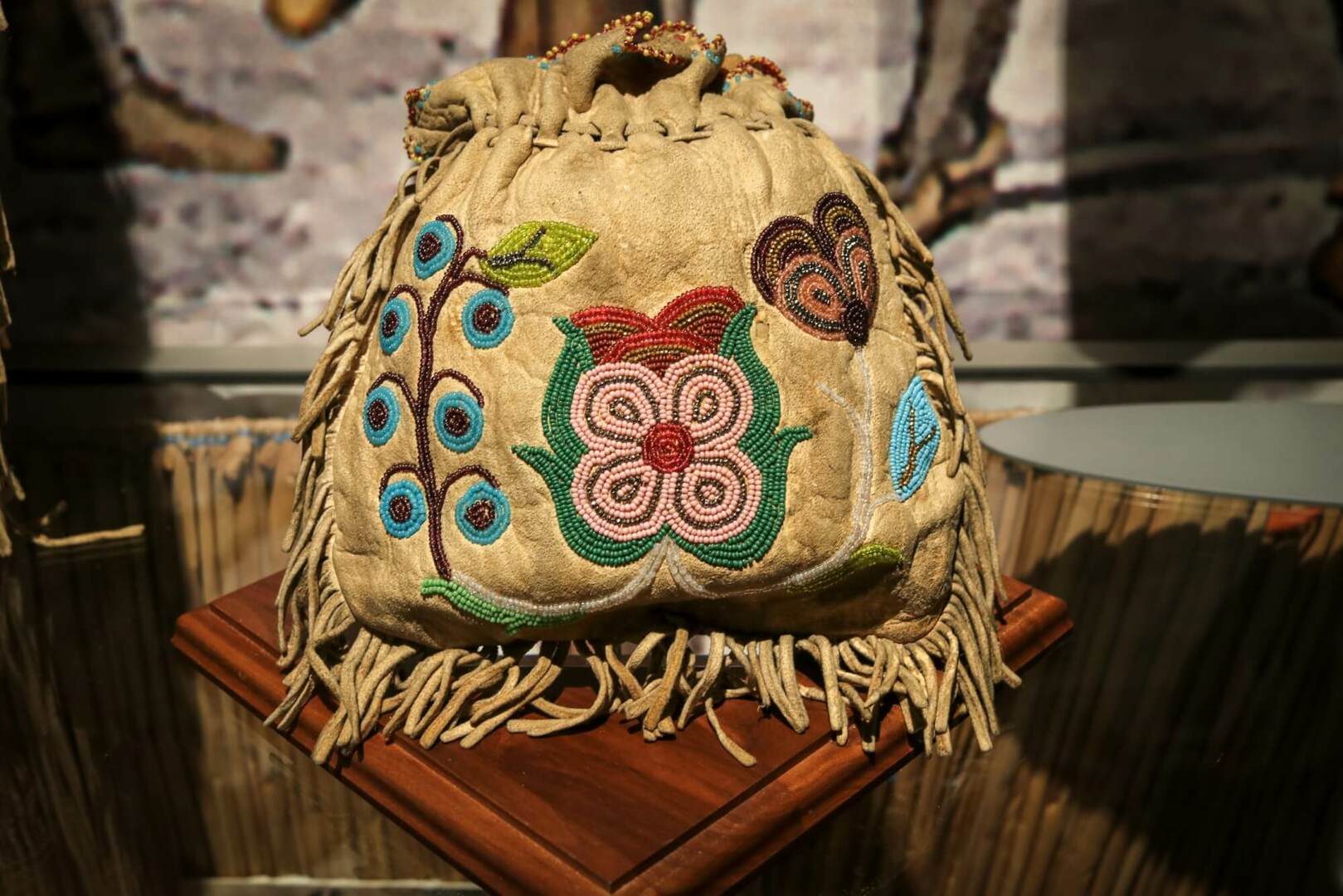 Decoratively beaded bag on display