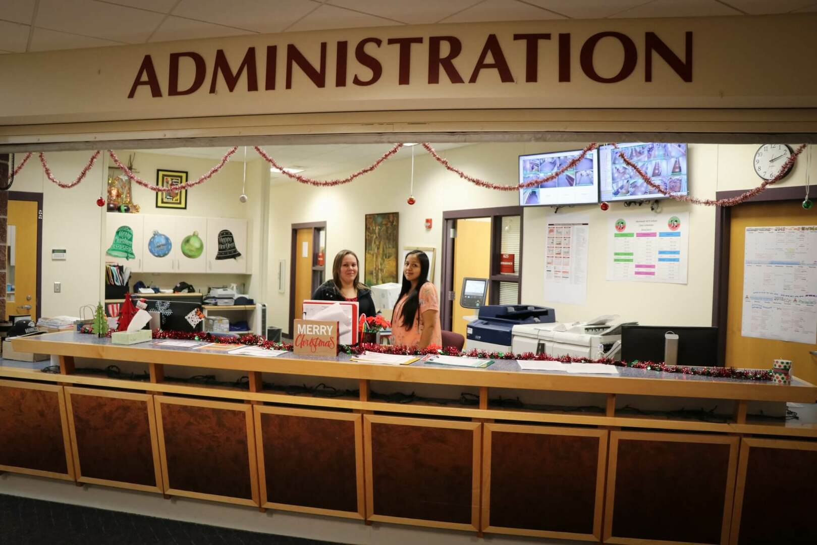 Two women at administration desk